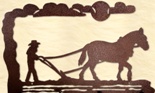 Farmer and horse plowing