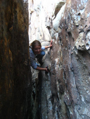 Emily Caza climbing vertical crack in Tennessee cliff