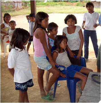 Pemon children in Awarouka, Venezuela watch as IRR team treats patients