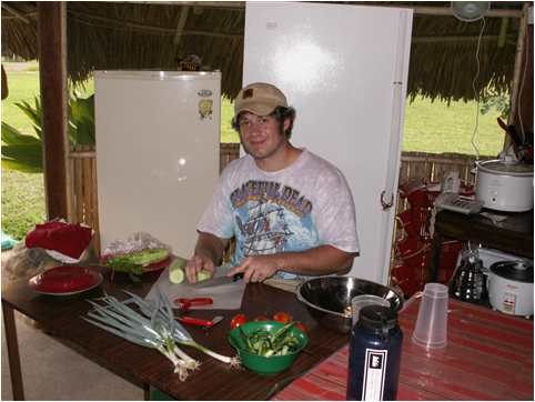Union College student Michael Hoppe preparing food for the IRR group in Venezuela