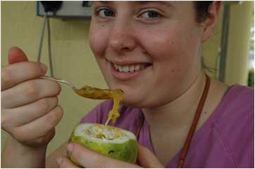 Corrie Sample eating slimy passion fruit in Venezuala