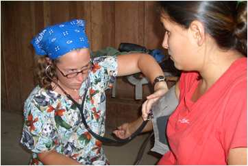 Corrie Sample takes blood pressure of Pemon lady in Venezuela