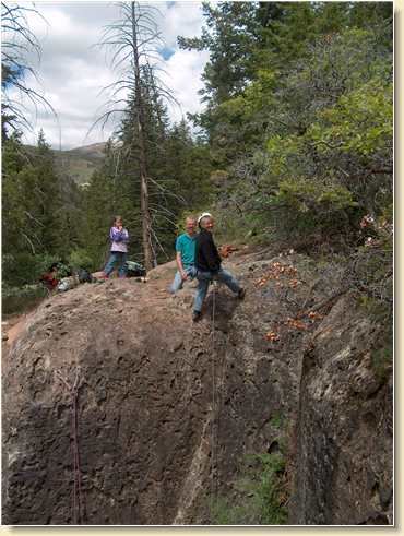Linda Adams rappelling cliff in LaSal Mountains