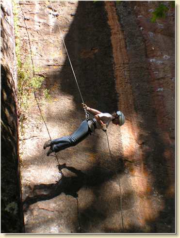 Sarah Ward doing horizontal leaps while rappelling face-down