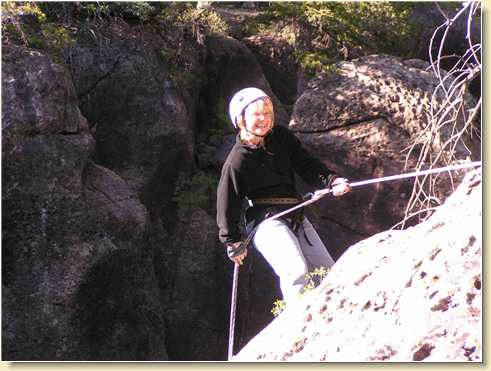 Linda Adams rappelling the free-fall cliff
