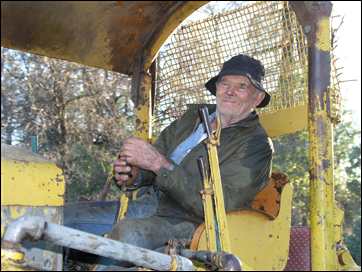 Celian Adams happily driving Oliver tractor