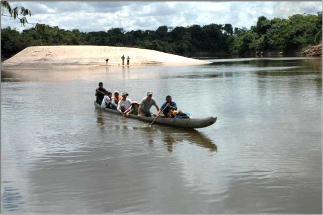 IRR team in dugout canoe on river near Caracol, Venezuela