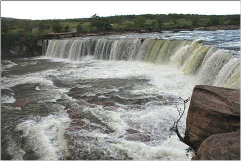 Wide waterfall on river in Venezuela