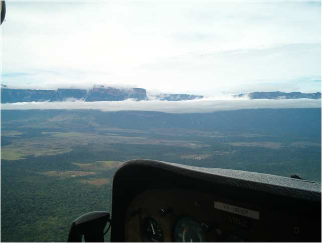 Mission plane flying over Venezuela jungles & savannahs