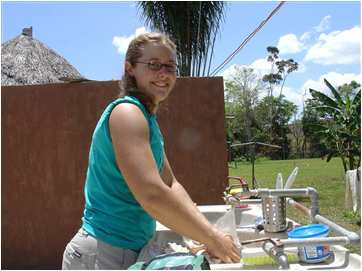 Corrie Sample washing dishes at IRR compound in Venezuela