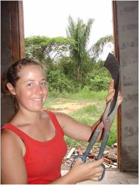 Corrie Sample cutting sandpaper with tin snips in Venezuela