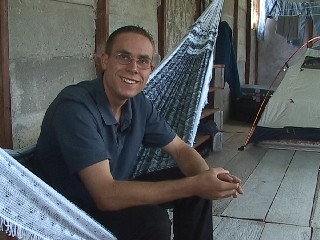 Daniel Adams smiling in hammock in Venezuela