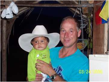 Bob Norton holding baby Jos in Venezuela