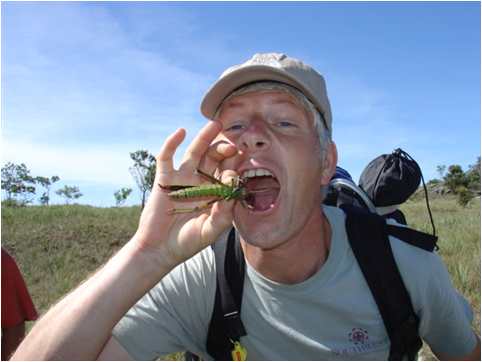 Mike Duehrssen eating a grashhopper