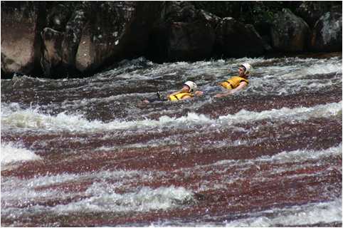 Brent Hildebrand & son Brenty float doww rapids during IRR swift-water rescue training in Venezuela