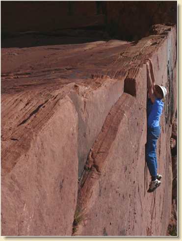 Diana Adams hanging from Parriott Mesa cliff edge