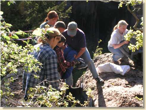 Lifting Fred Adams back into his wheelchair