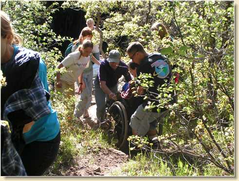 Pulling Fred Adams up the steep trail