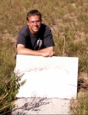 Daniel Adams at grave of Pastor Davis near Mt. Roraima