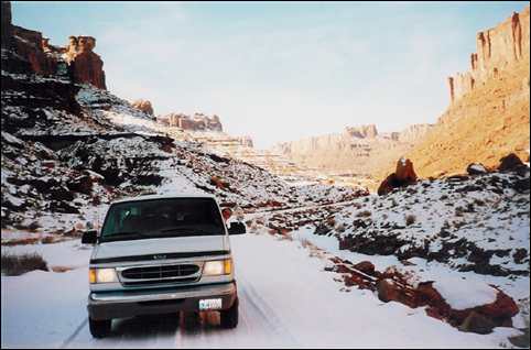 Daniel driving the van in snow near Canyonlands