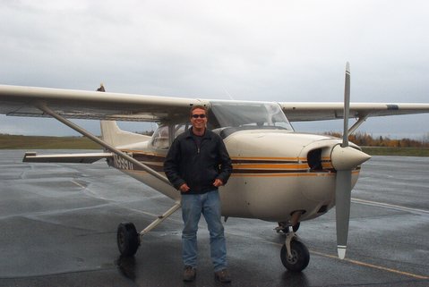 Daniel Adams by plane after first solo flight