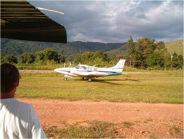 David Gates taking off in his twin-engine plane