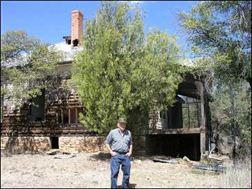 Celian Adams by abandoned house in Duquesne, Arizona