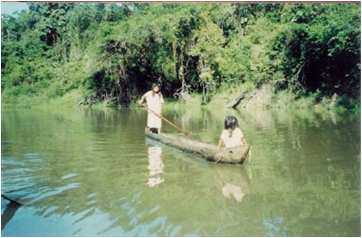 Lacandon children in dugout canoe
