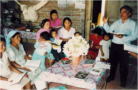 Layman sharing the Gospel in a Mexican home