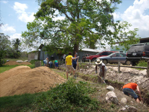 Volunteers digging at La Loma Luz in Belize