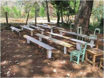 Makeshift benches under trees for Sabbath worship